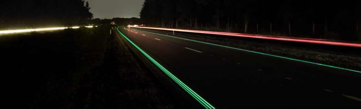 Image of a night road with reflective signs